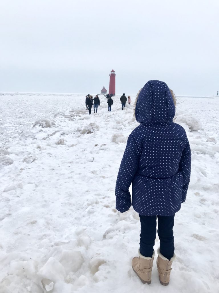 Grand Haven Pier and lighthouse. walking on frozen pier