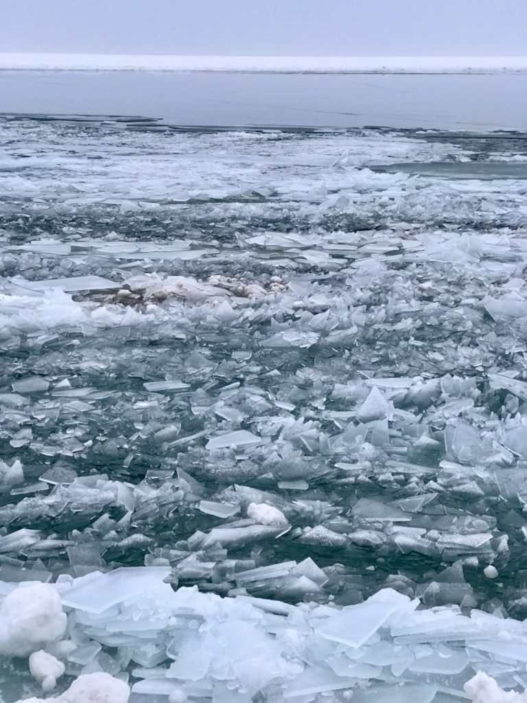 Grand Haven Pier and lighthouse. Ice in open water